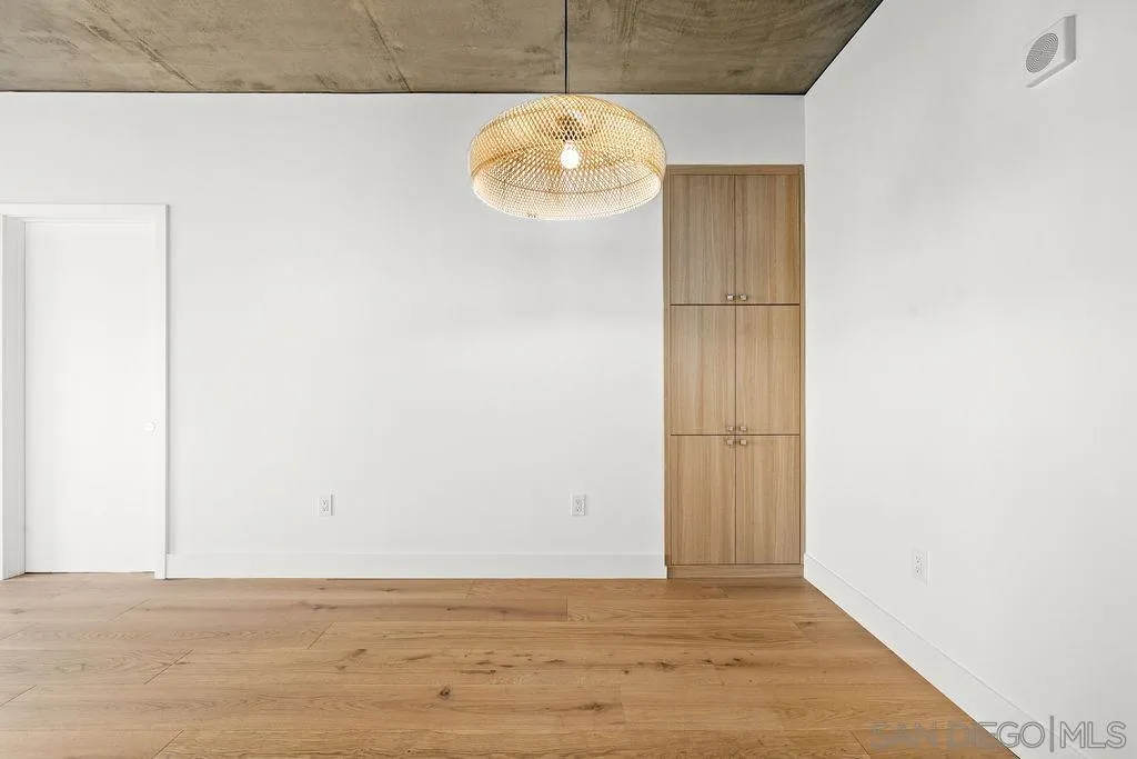 801 Ash Street, Unit 402 San Diego, CA 92101 - Photo 14 of 31 a view of a livingroom with wooden floor