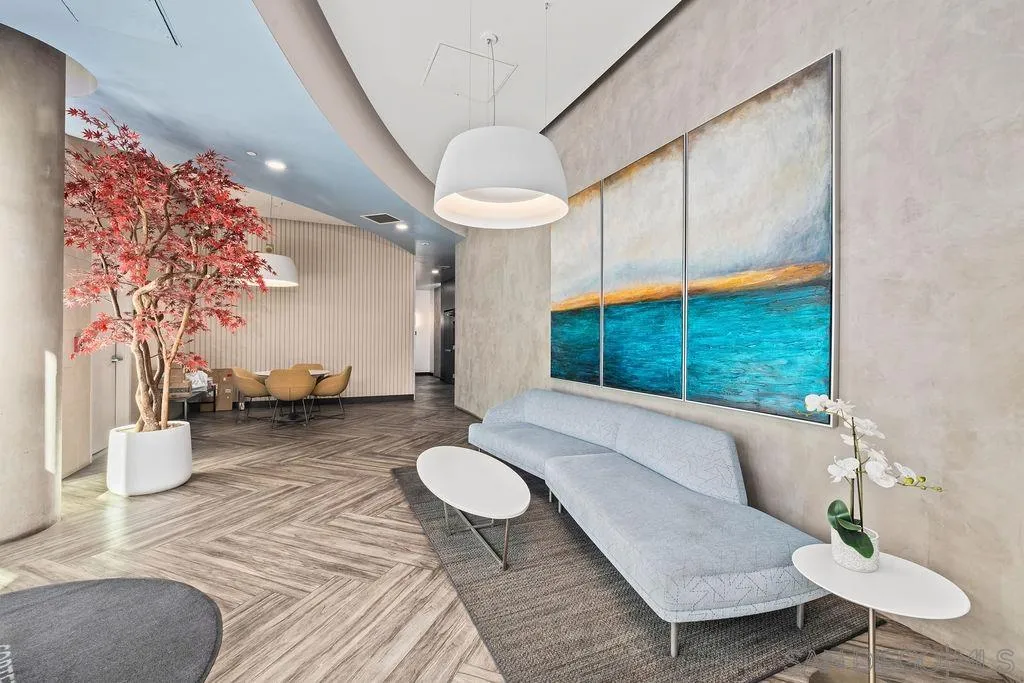 801 Ash Street, Unit 402 San Diego, CA 92101 - Photo 4 of 31 a living room with furniture and a large window