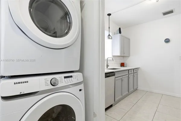 a view of a kitchen with washer and dryer
