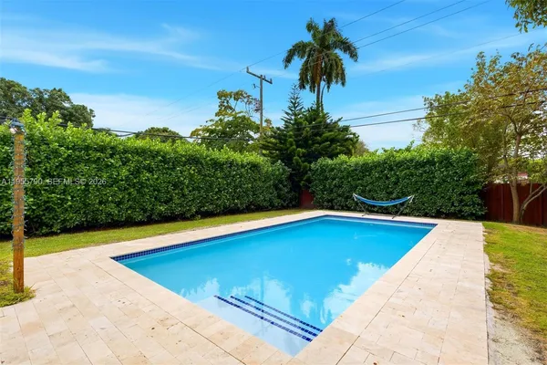 a view of swimming pool with a yard