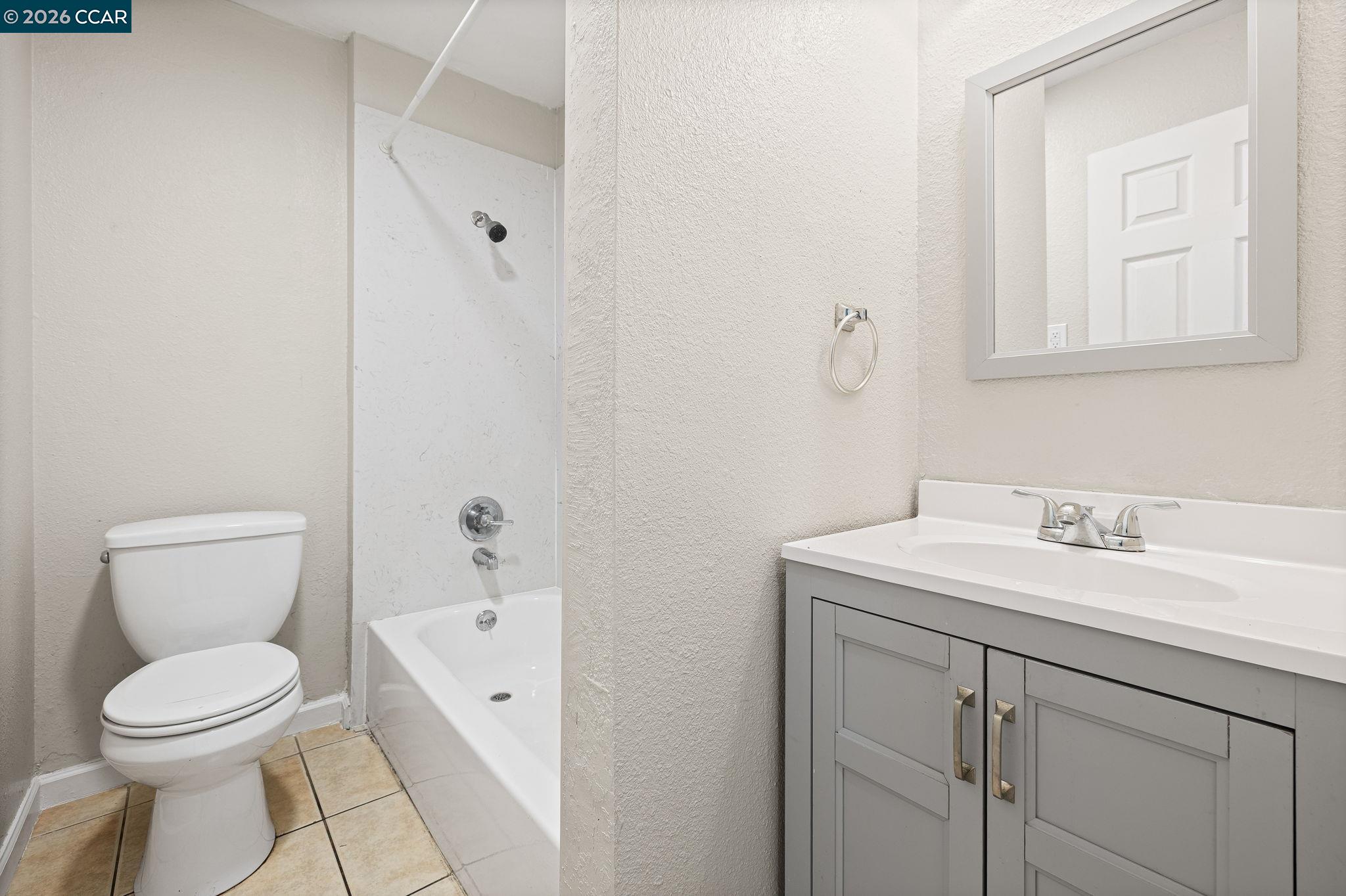 4820 Blum Road Martinez, CA 94553 - Photo 39 of 46 a bathroom with a toilet sink and mirror