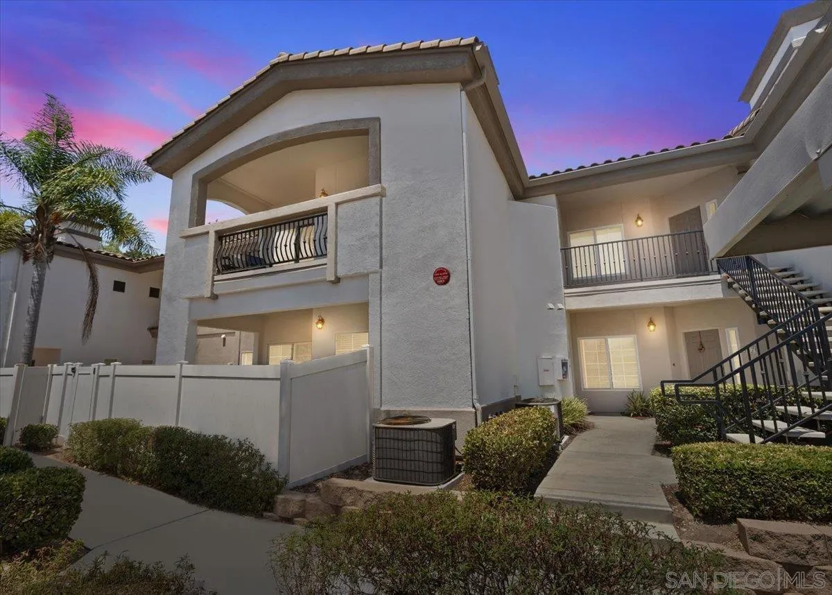 2715 Lake Pointe Drive, Unit 116 Spring Valley, CA 91977 - Photo 1 of 25 a front view of a house with garden