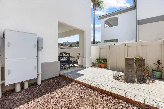 a bedroom with a bed a table and chair