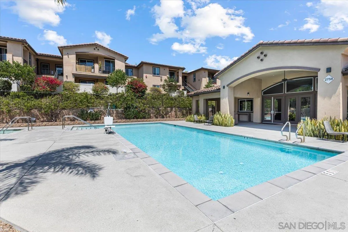 2715 Lake Pointe Drive, Unit 116 Spring Valley, CA 91977 - Photo 25 of 25 a front view of a house with swimming pool and porch
