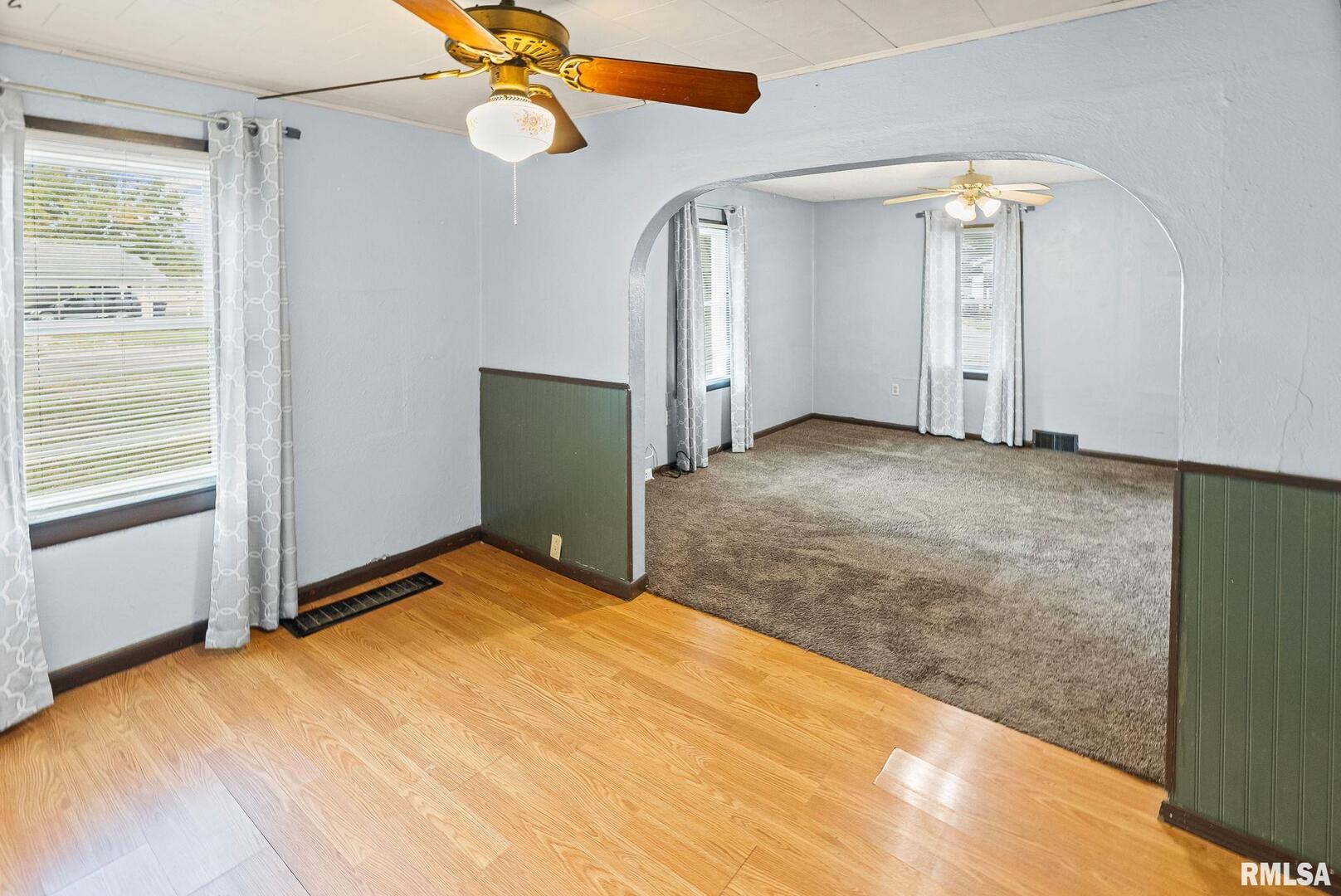 721 West Whittaker Street Salem, IL 62881 - Photo 12 of 25 a view of empty room with ceiling fan and window