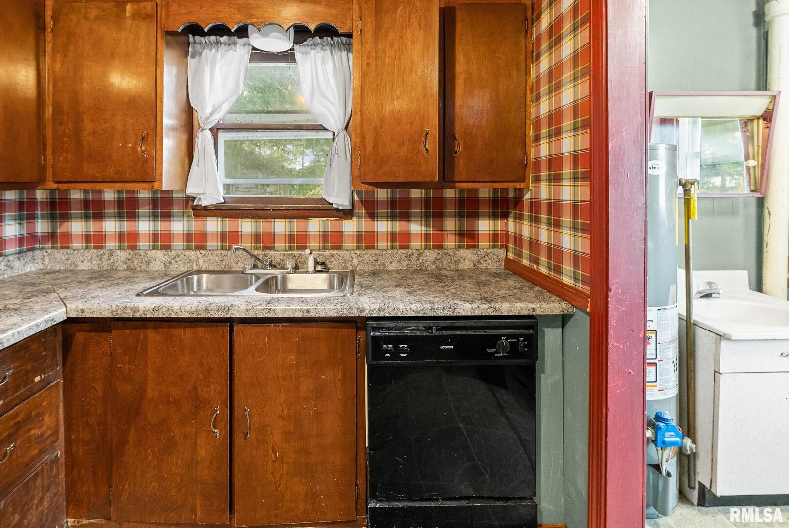 721 West Whittaker Street Salem, IL 62881 - Photo 16 of 25 a kitchen with a sink a cabinets and window