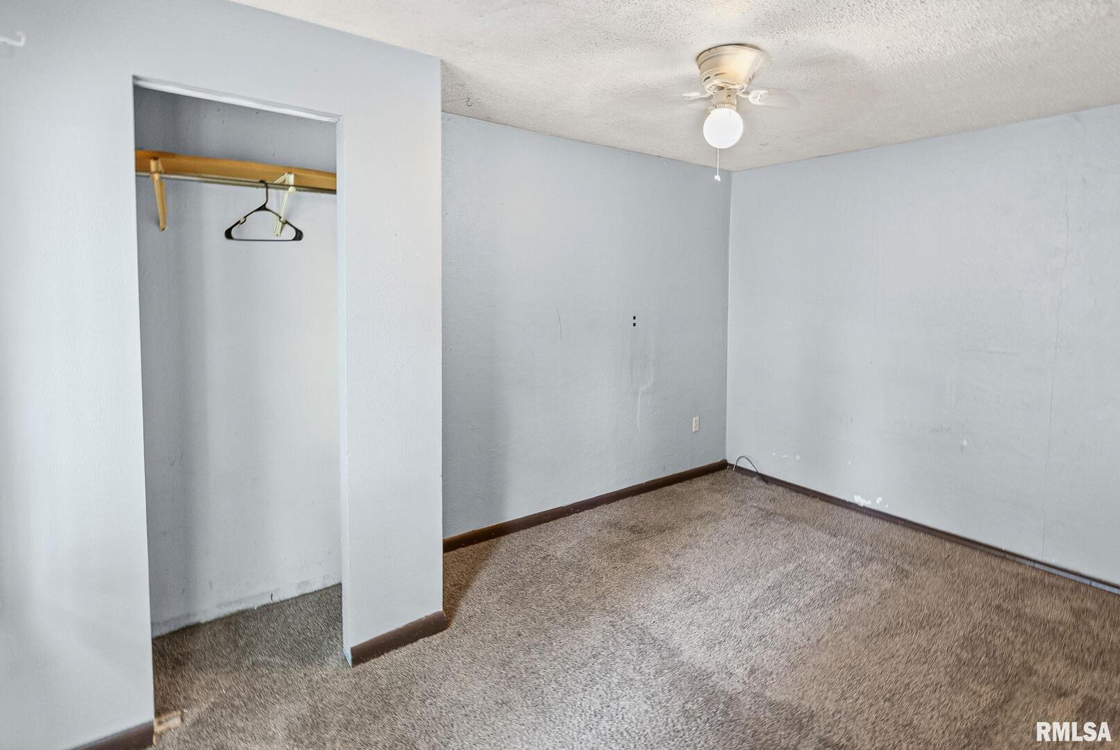 721 West Whittaker Street Salem, IL 62881 - Photo 9 of 25 an empty room with windows and closet