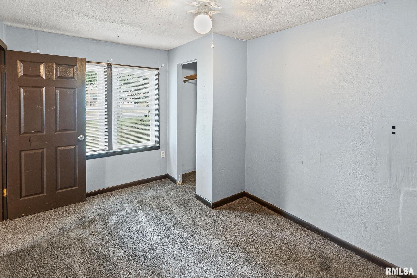 721 West Whittaker Street Salem, IL 62881 - Photo 10 of 25 an empty room with windows