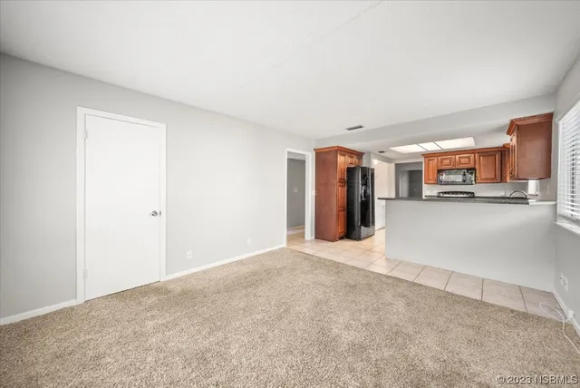 a large kitchen with granite countertop a sink and a stove