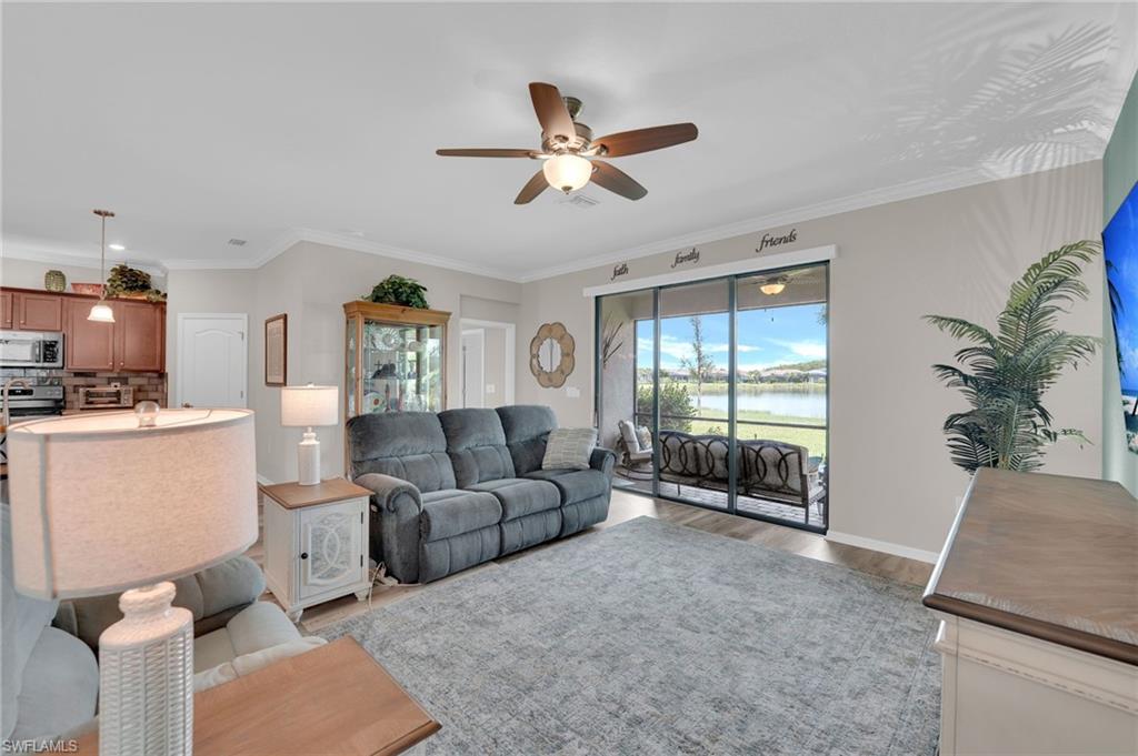 19565 Deming Lane Estero, FL 33928 - Photo 13 of 43 a living room with furniture and a large window