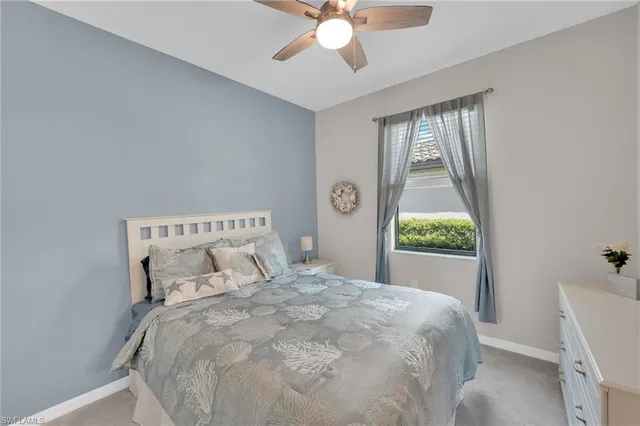 a large white bed in a white room