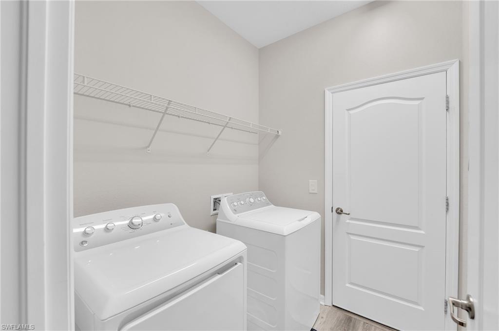 19565 Deming Lane Estero, FL 33928 - Photo 18 of 43 a utility room with dryer and washer