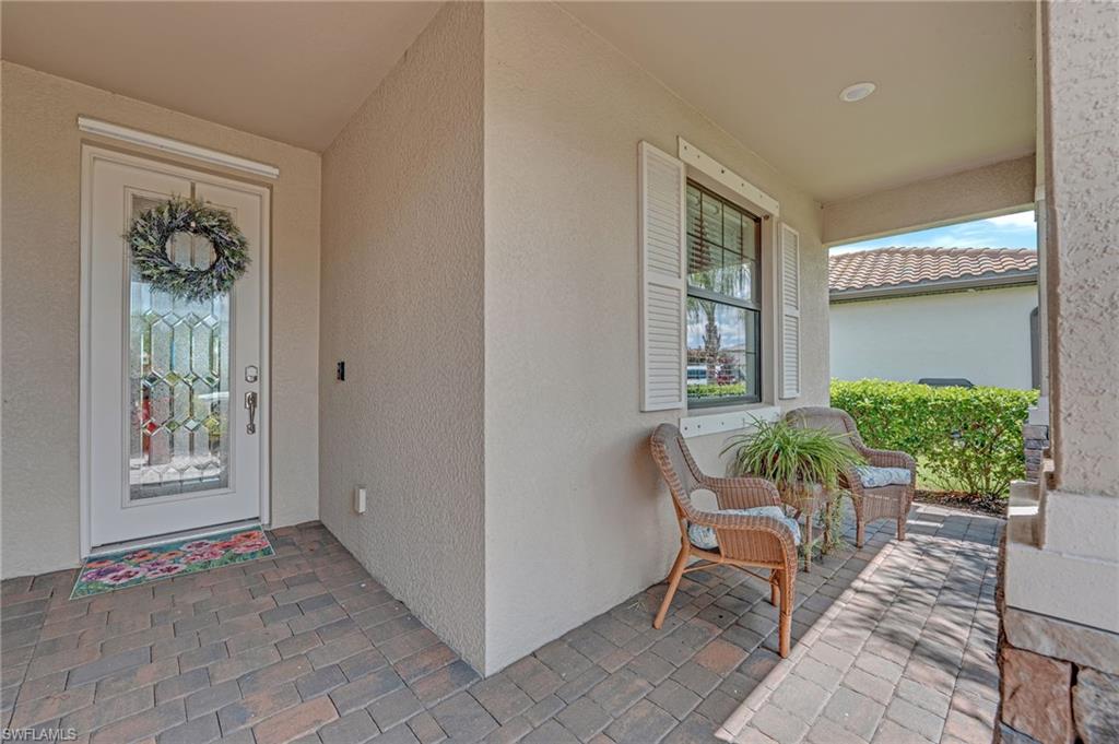 19565 Deming Lane Estero, FL 33928 - Photo 8 of 43 a view of an entryway with outdoor seating