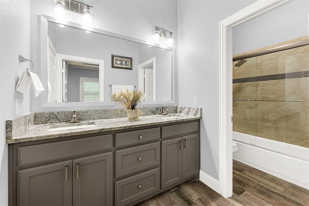 2613 Ranch Court Cedar Hill, TX 75104 - Photo 16 of 29 a bathroom with a granite countertop sink mirror and