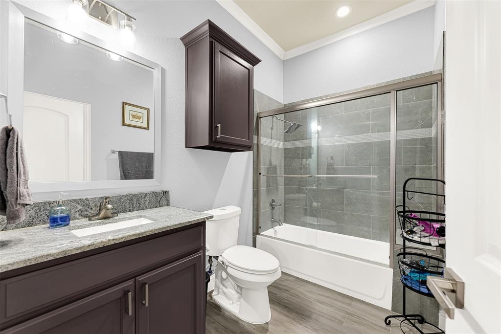 2613 Ranch Court Cedar Hill, TX 75104 - Photo 18 of 29 a bathroom with a granite countertop sink toilet and shower