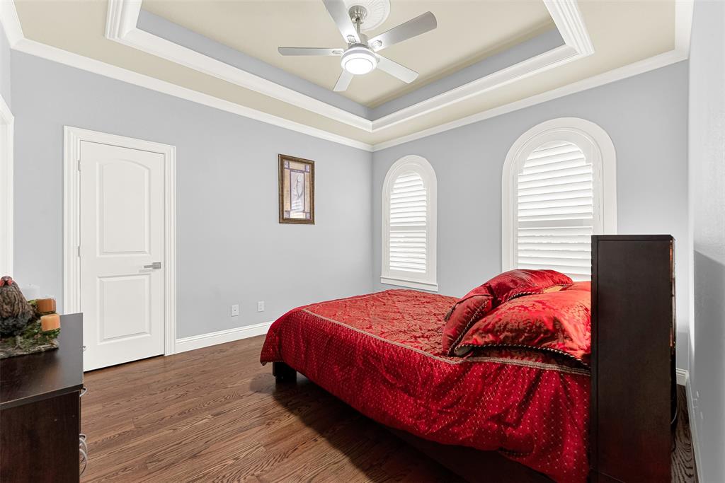 2613 Ranch Court Cedar Hill, TX 75104 - Photo 19 of 29 a bedroom with a bed and wooden floor