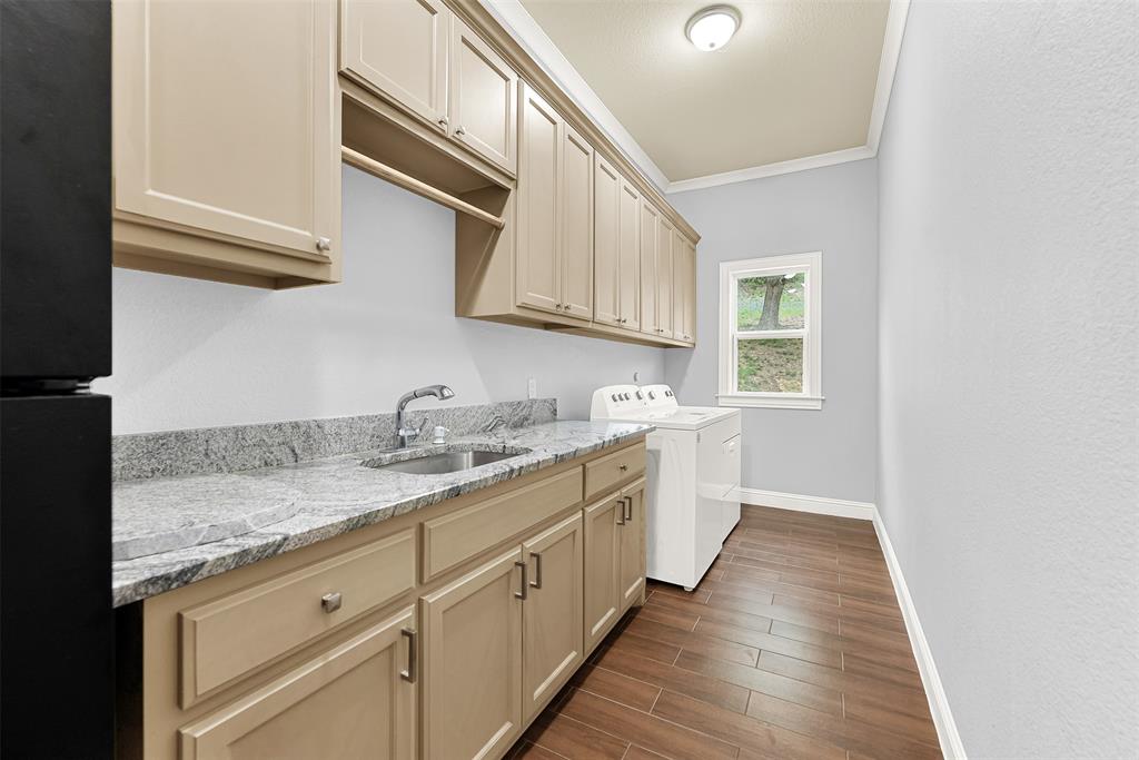 2613 Ranch Court Cedar Hill, TX 75104 - Photo 22 of 29 a kitchen with granite countertop a sink and cabinets