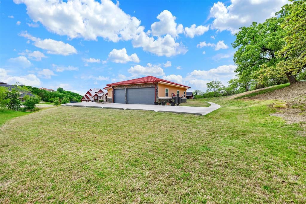 2613 Ranch Court Cedar Hill, TX 75104 - Photo 25 of 29 a house view with swimming pool and trees in the background