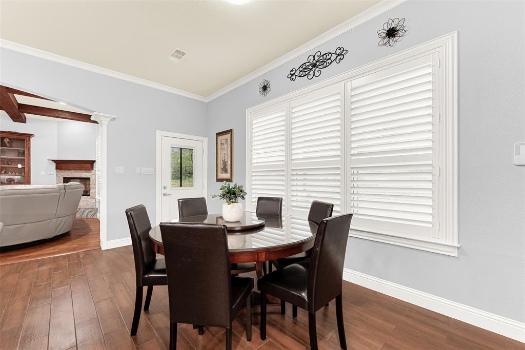 2613 Ranch Court Cedar Hill, TX 75104 - Photo 5 of 29 a view of a dining room with furniture and wooden floor