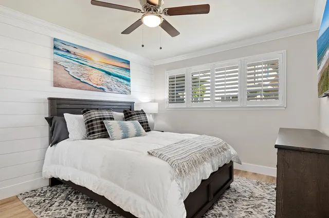 a bedroom with bed and window