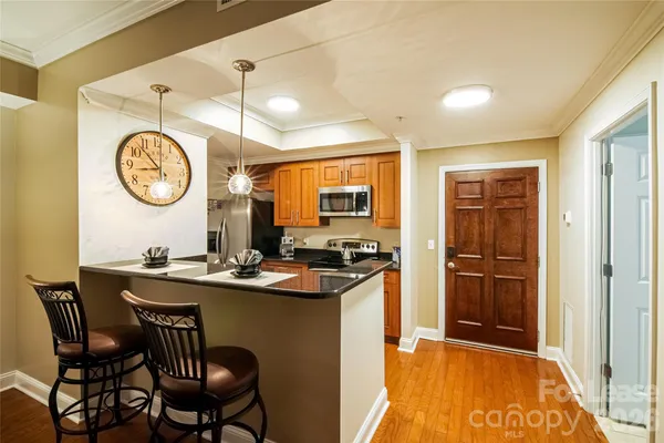 a kitchen with a table and chairs