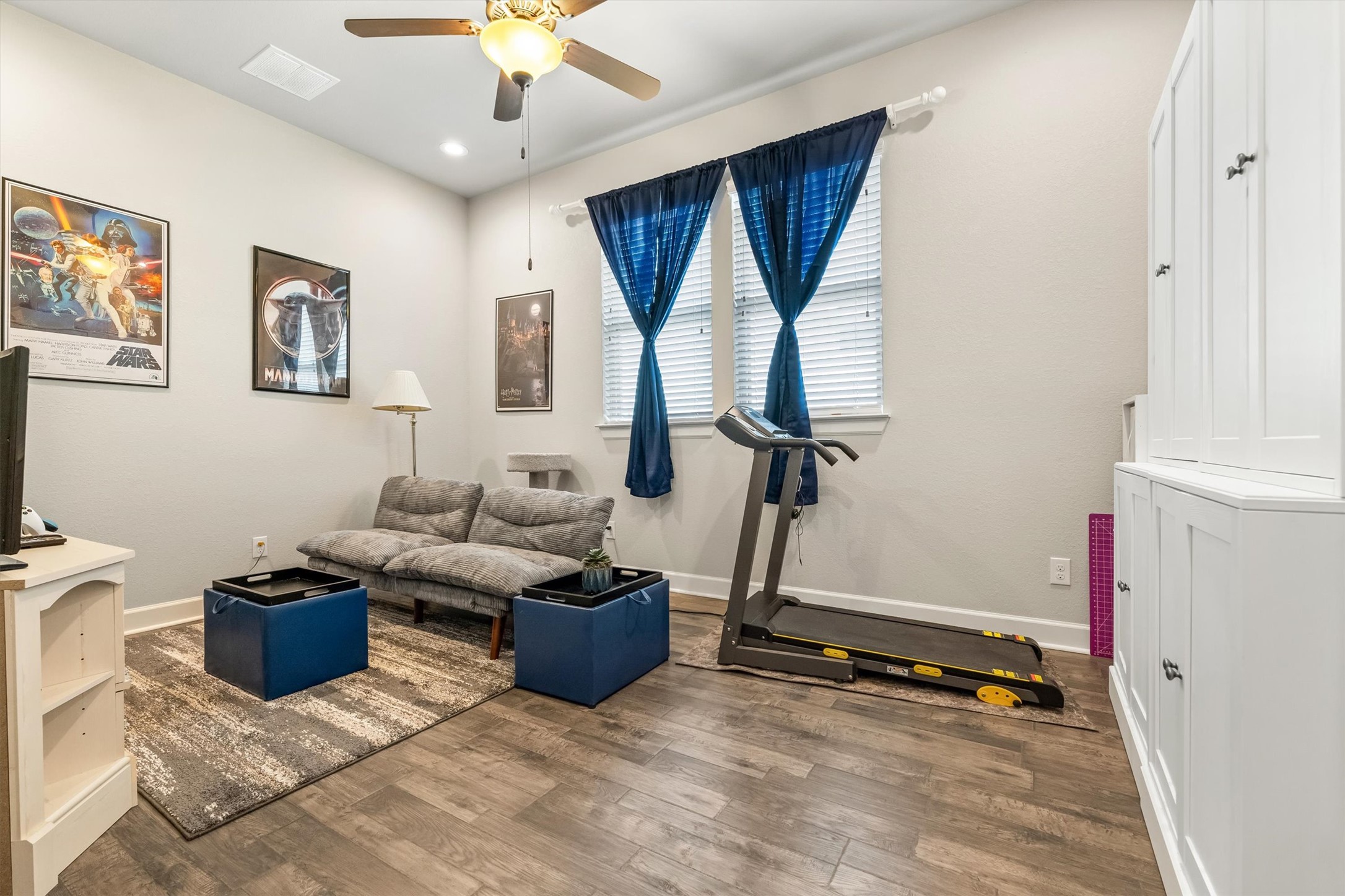 1004 Hezekiah Lane Leander, TX 78641 - Photo 21 of 36 Room featuring wood-finish flooring, recessed lighting, and a ceiling fan with integrated light fixture