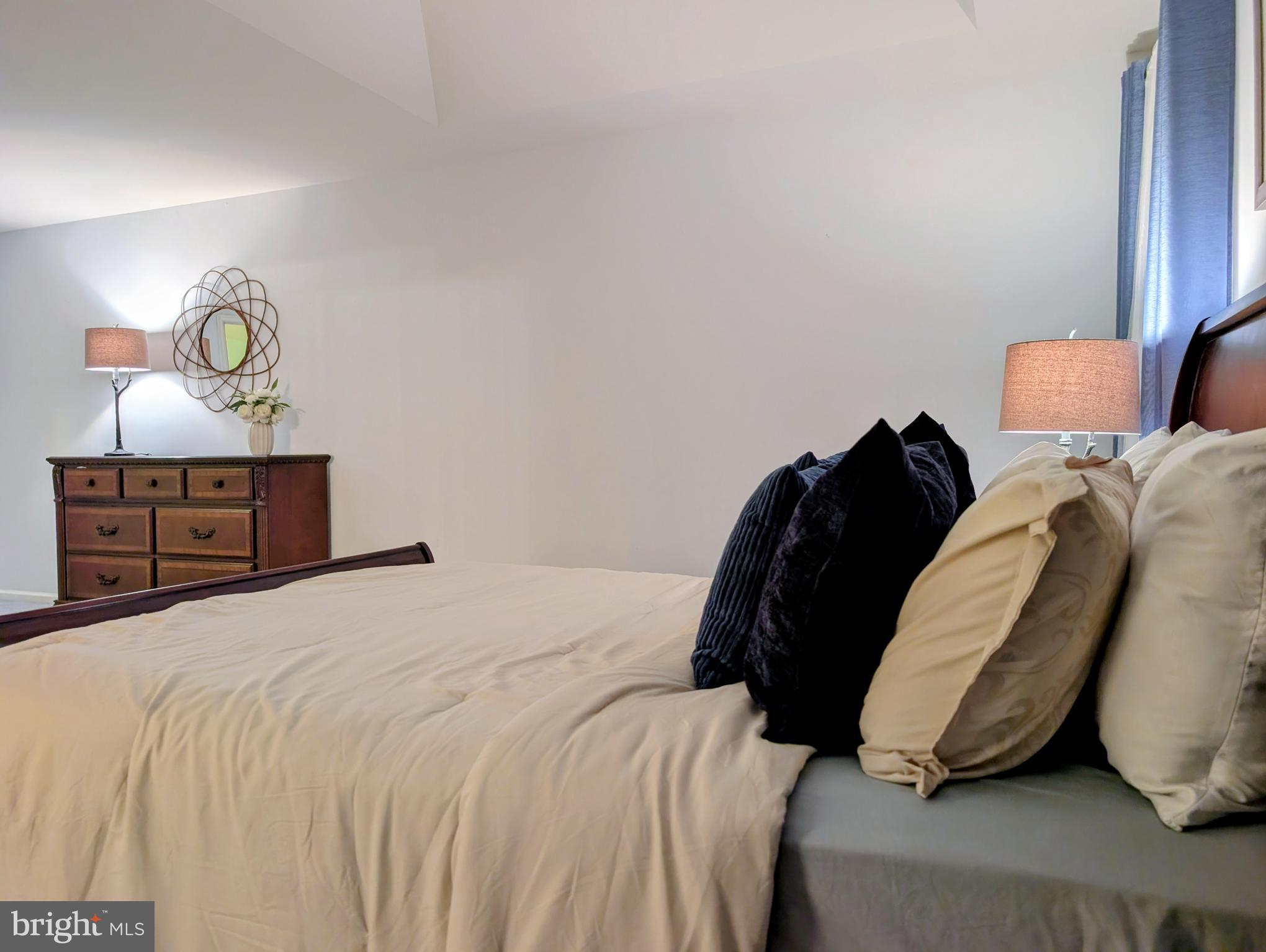 21 Miller Circle Pennington, NJ 08534 - Photo 11 of 14 a bedroom with a bed and painting on the wall