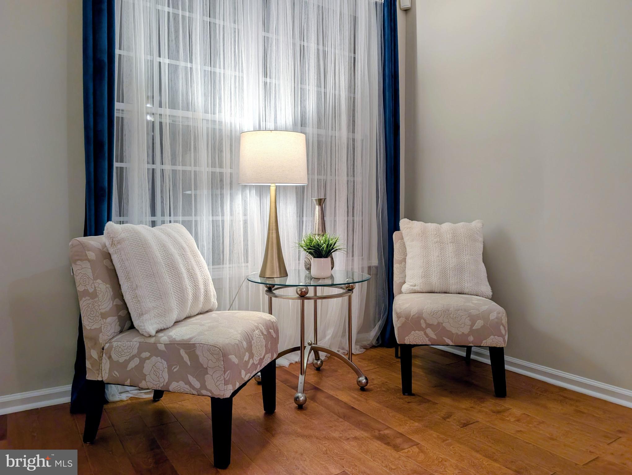 21 Miller Circle Pennington, NJ 08534 - Photo 2 of 14 a living room with furniture and a lamp
