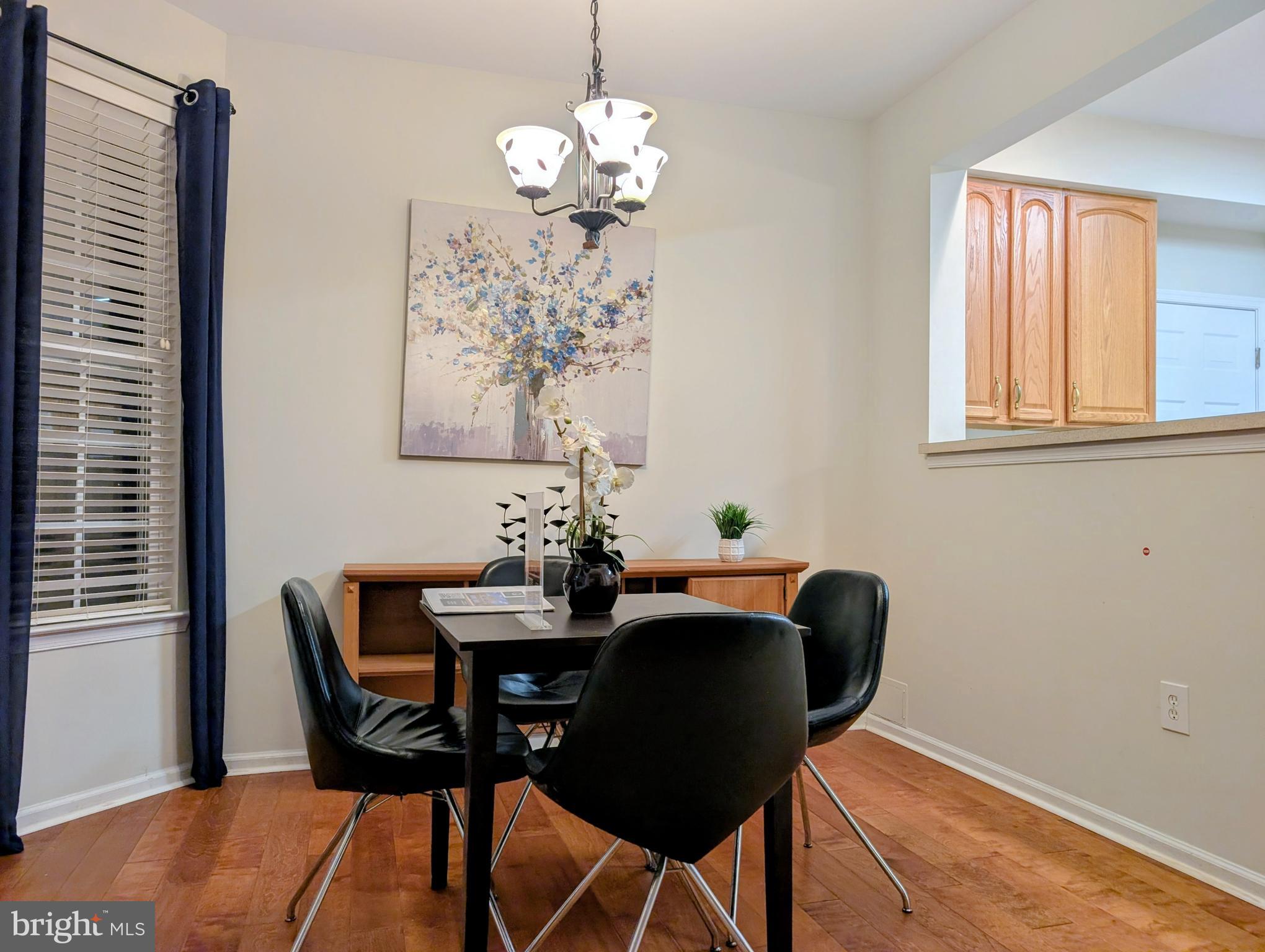 21 Miller Circle Pennington, NJ 08534 - Photo 3 of 14 a dining room with chandelier and wooden floor
