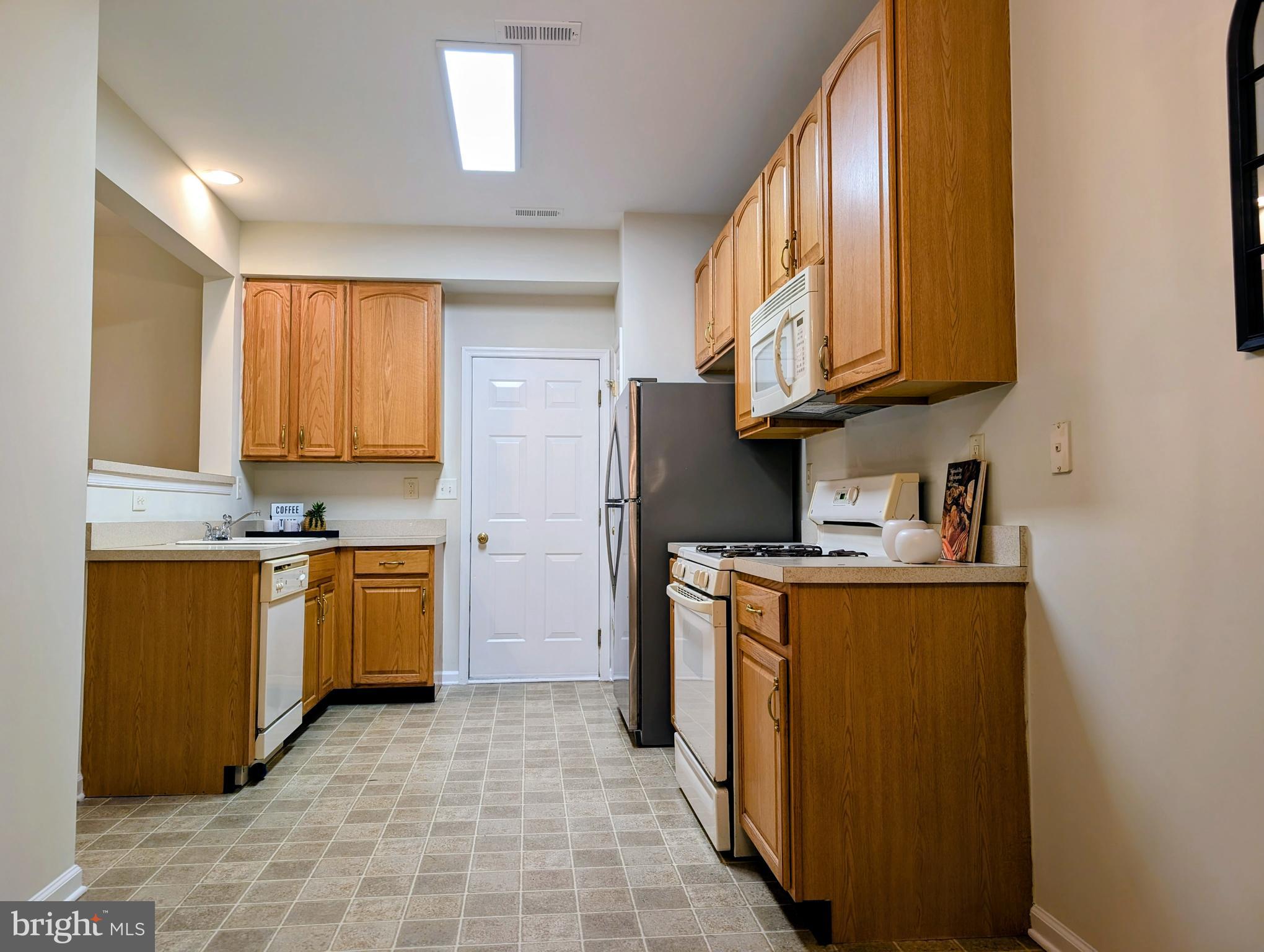 21 Miller Circle Pennington, NJ 08534 - Photo 4 of 14 a kitchen with stainless steel appliances granite countertop a stove a sink and a refrigerator