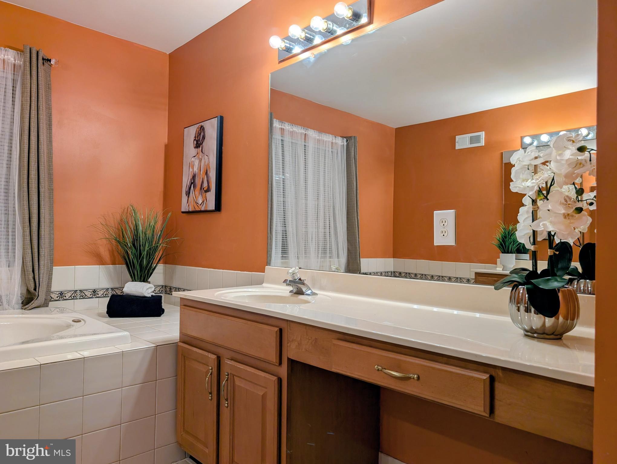 21 Miller Circle Pennington, NJ 08534 - Photo 9 of 14 a bathroom with a sink double vanity and a mirror