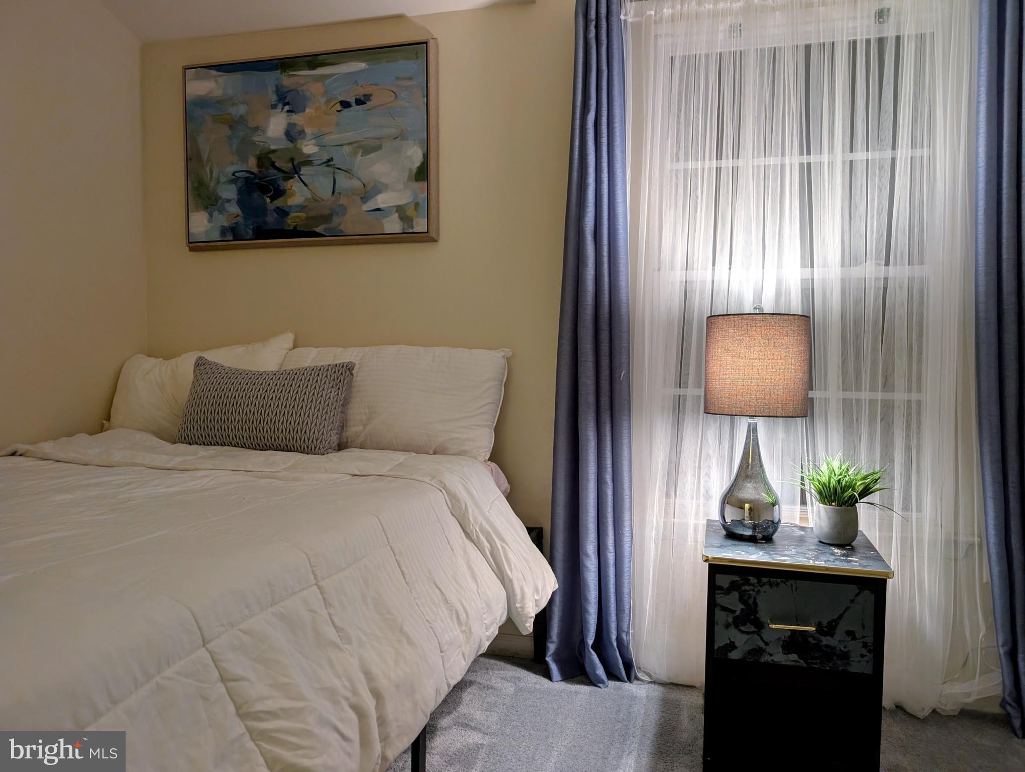 21 Miller Circle Pennington, NJ 08534 - Photo 10 of 14 a bedroom with a bed and a painting on the wall