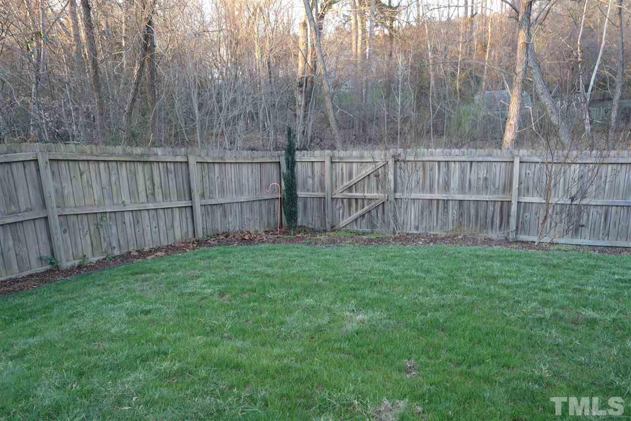 3921 Hopper Street Raleigh, NC 27616 - Photo 24 of 24 a view of backyard with wooden fence