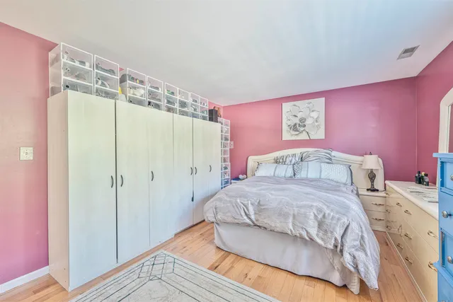 a bedroom with a bed and a shower