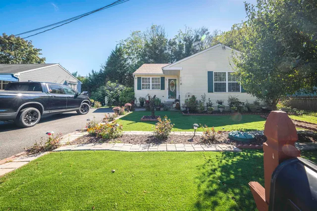 a view of a house with a yard patio and swimming pool