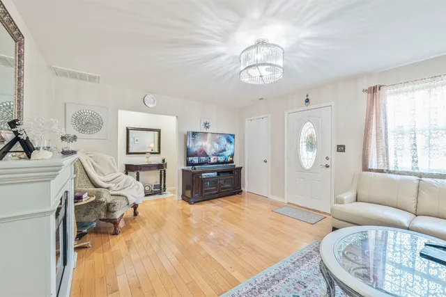 a bedroom with a bed a couch and dresser