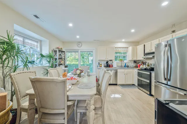 a kitchen with a table and chairs