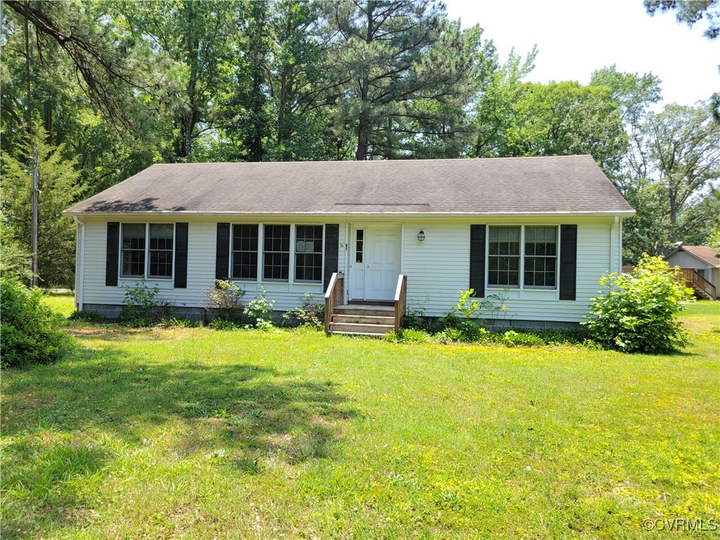 67 Lewis Road Lancaster, VA 22503 - Photo 1 of 14 View of front of house with a front yard