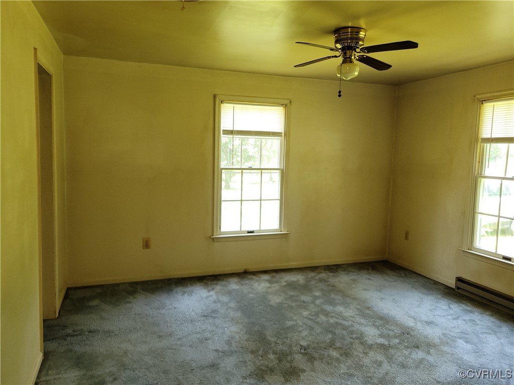 67 Lewis Road Lancaster, VA 22503 - Photo 6 of 14 Carpeted empty room featuring healthy amount of na