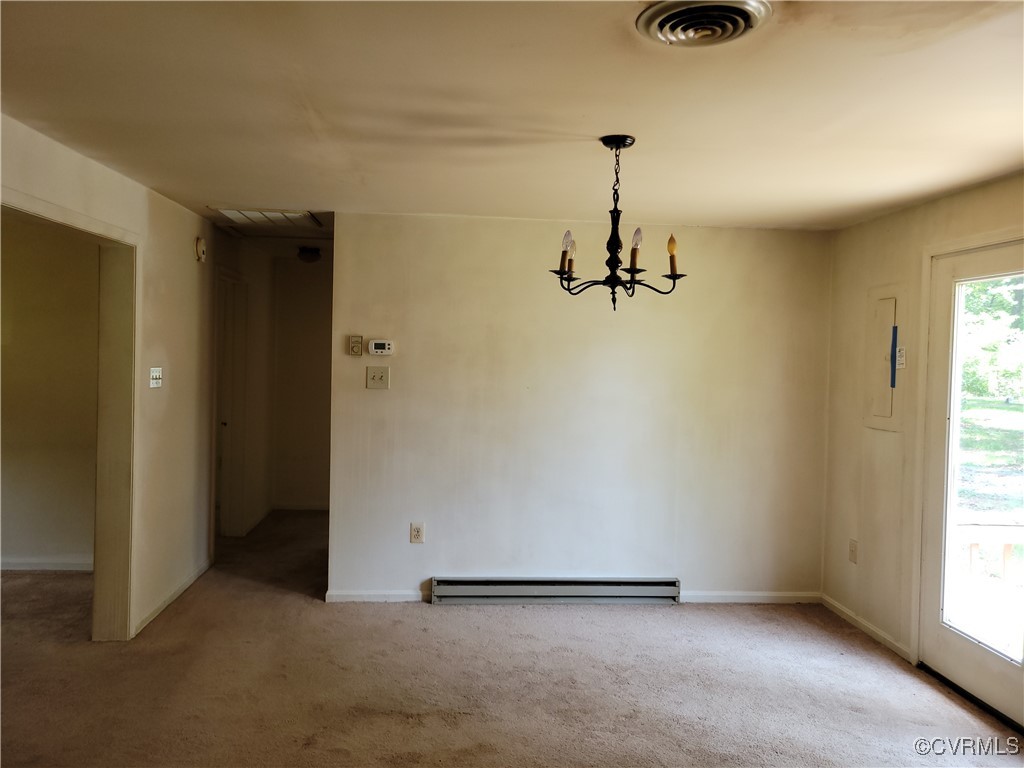 67 Lewis Road Lancaster, VA 22503 - Photo 9 of 14 Unfurnished dining area with a baseboard radiator,