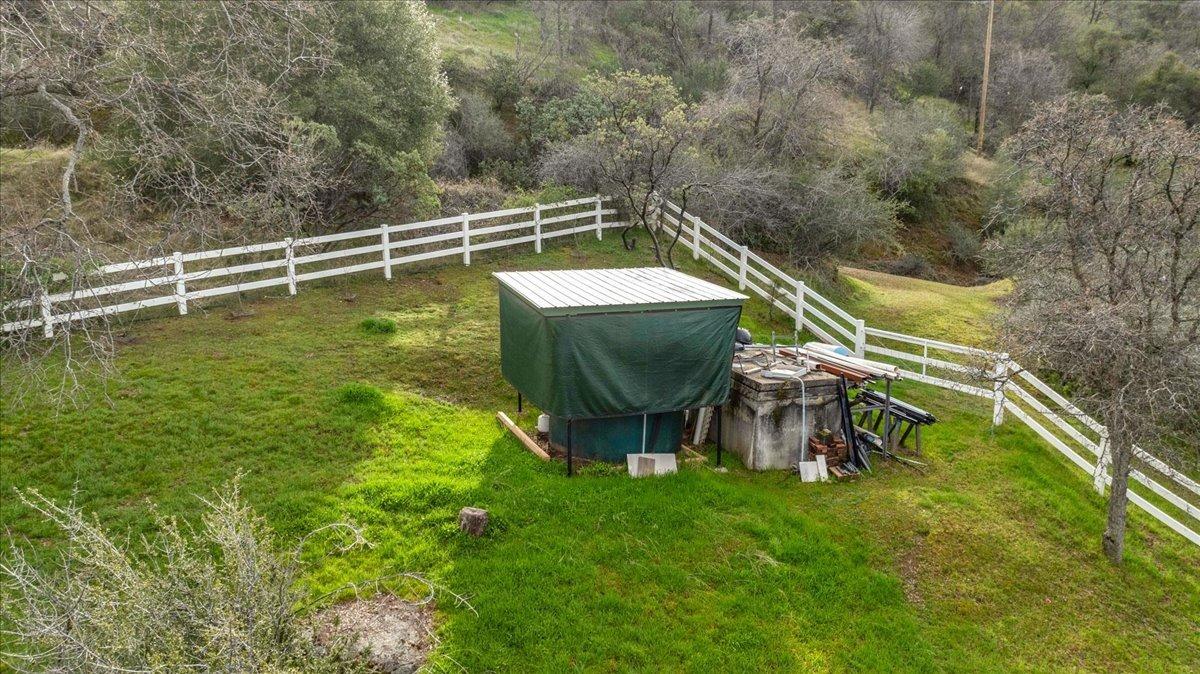 46473 Konklin Road Coarsegold, CA 93614 - Photo 32 of 38 a view of a swimming pool with a yard