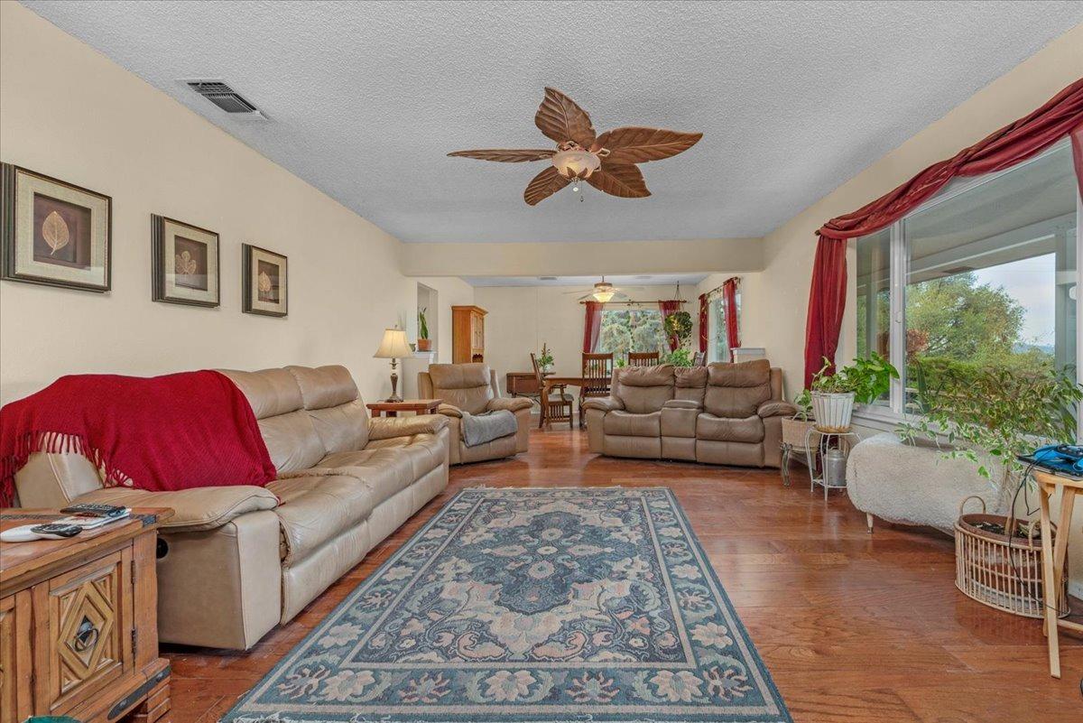 46473 Konklin Road Coarsegold, CA 93614 - Photo 6 of 38 a living room with furniture or couch and a large window