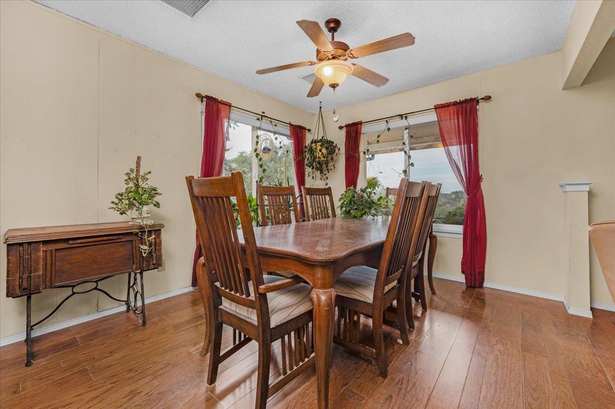 46473 Konklin Road Coarsegold, CA 93614 - Photo 8 of 38 a view of a dining room with furniture and wooden floor