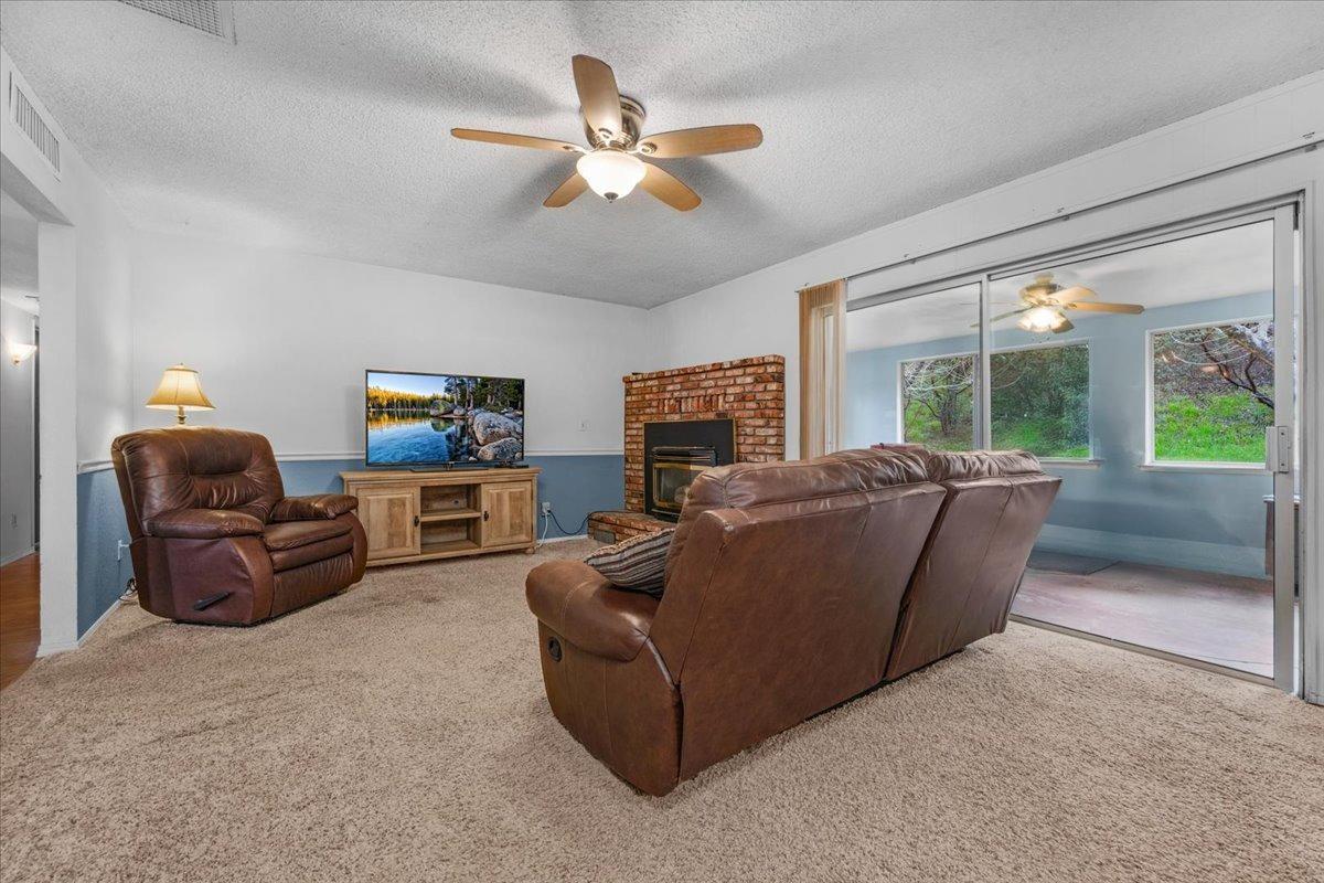 46473 Konklin Road Coarsegold, CA 93614 - Photo 9 of 38 a living room with furniture and a ceiling fan