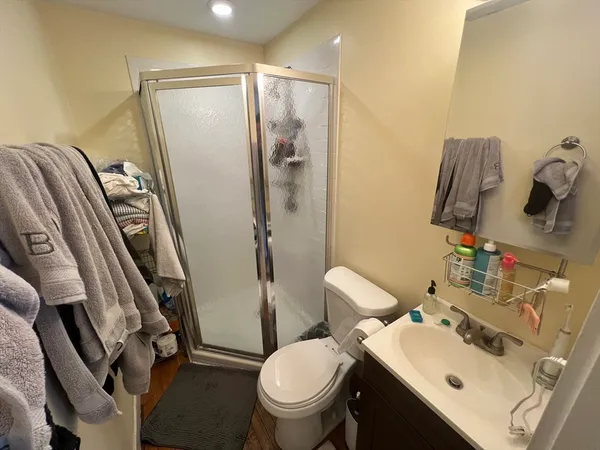 a bathroom with a sink toilet and shower
