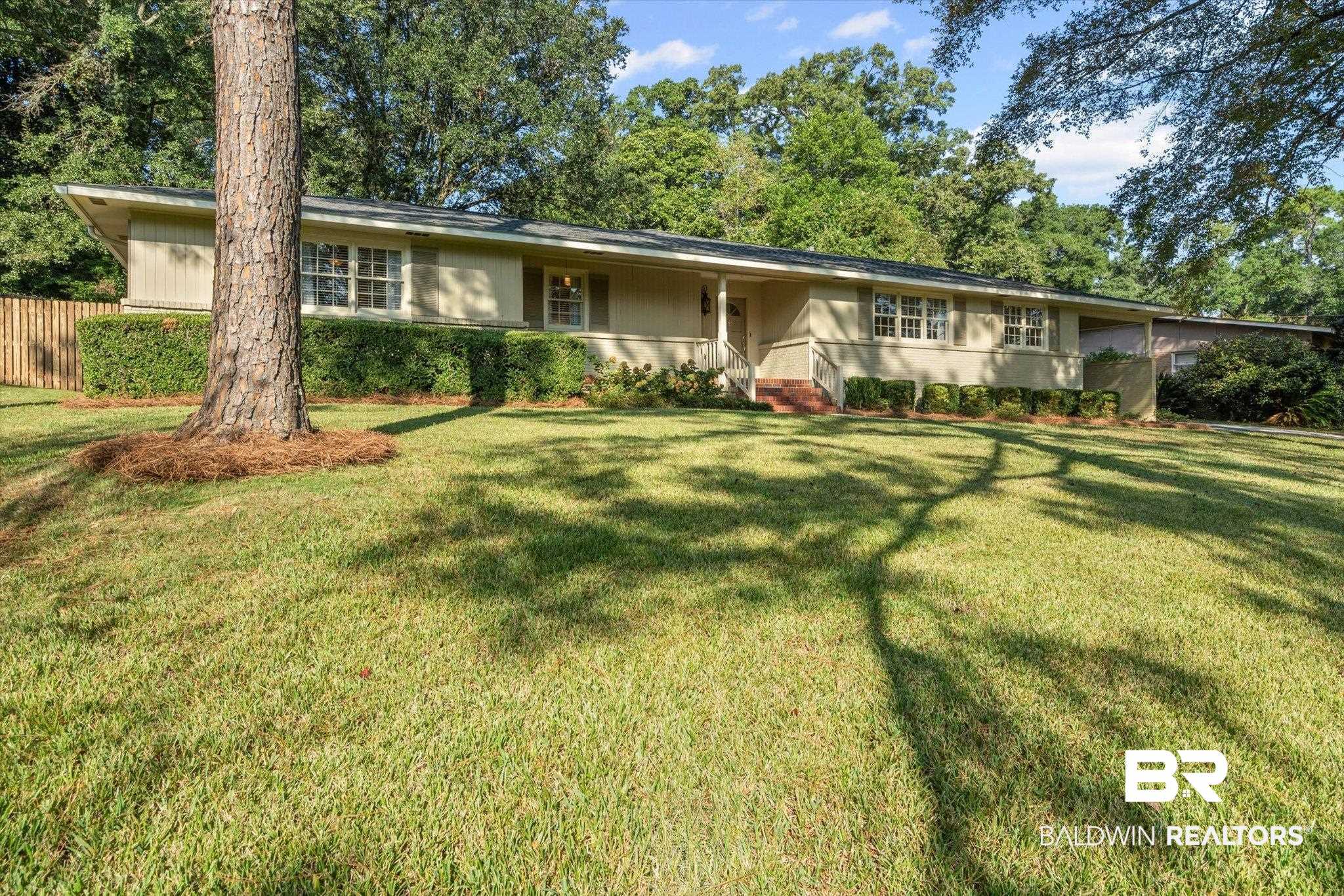 313 Brawood Drive Mobile, AL 36608 - Photo 29 of 32 Ranch-style house with a front lawn and covered porch