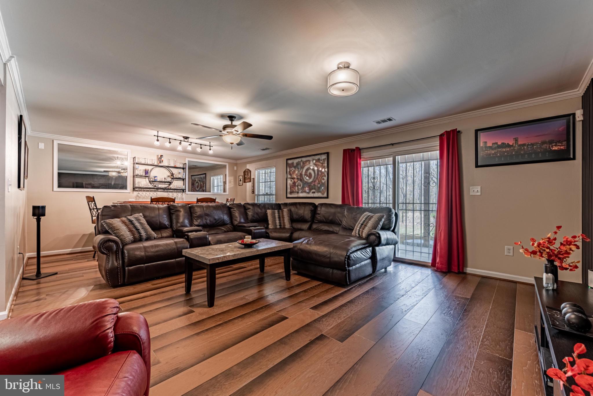 60 6 Point Court Baltimore, MD 21244 - Photo 20 of 28 a living room with furniture flowers and wooden floor