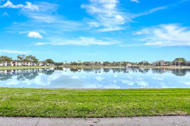 a view of lake with houses in the back