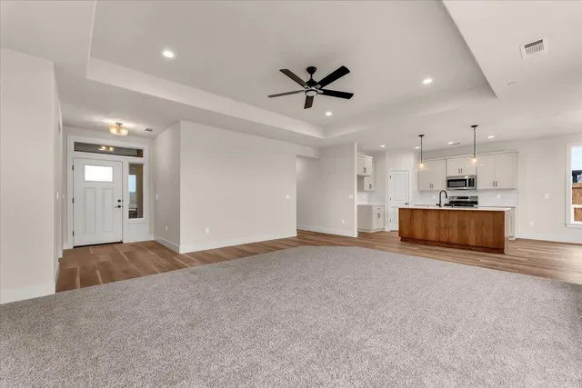 a view of a kitchen with a sink and a stove top oven
