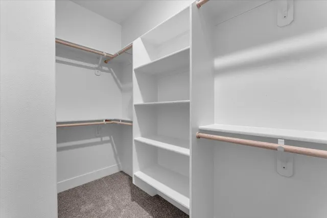 a view of an empty walk in closet